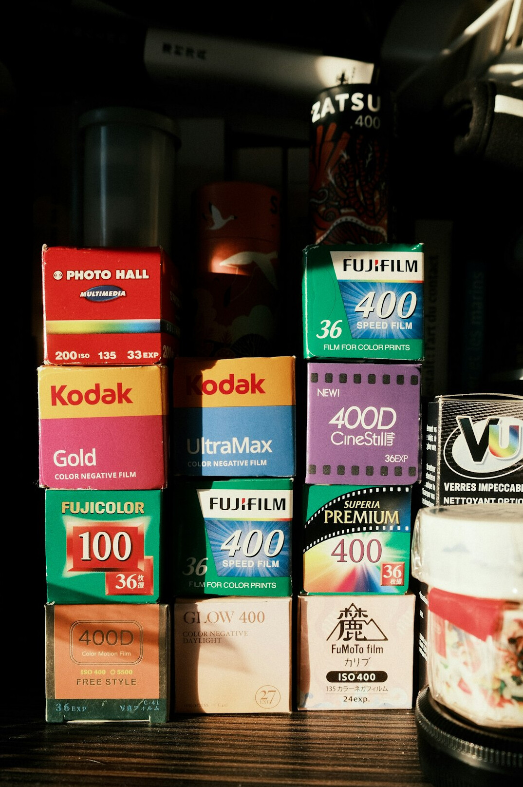 Shelves filled with vintage videotapes and film canisters