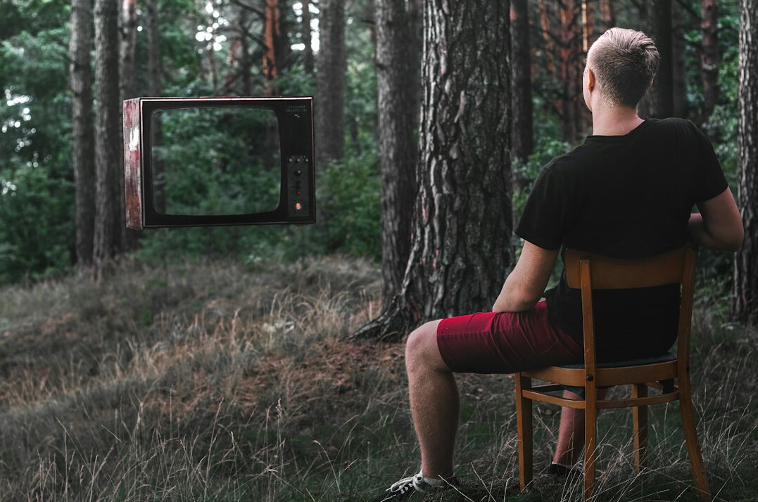 person watching old tv